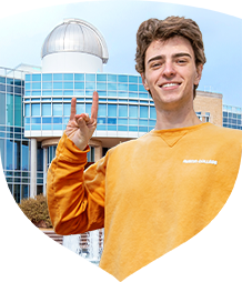 Image of professor showing student something on the computer